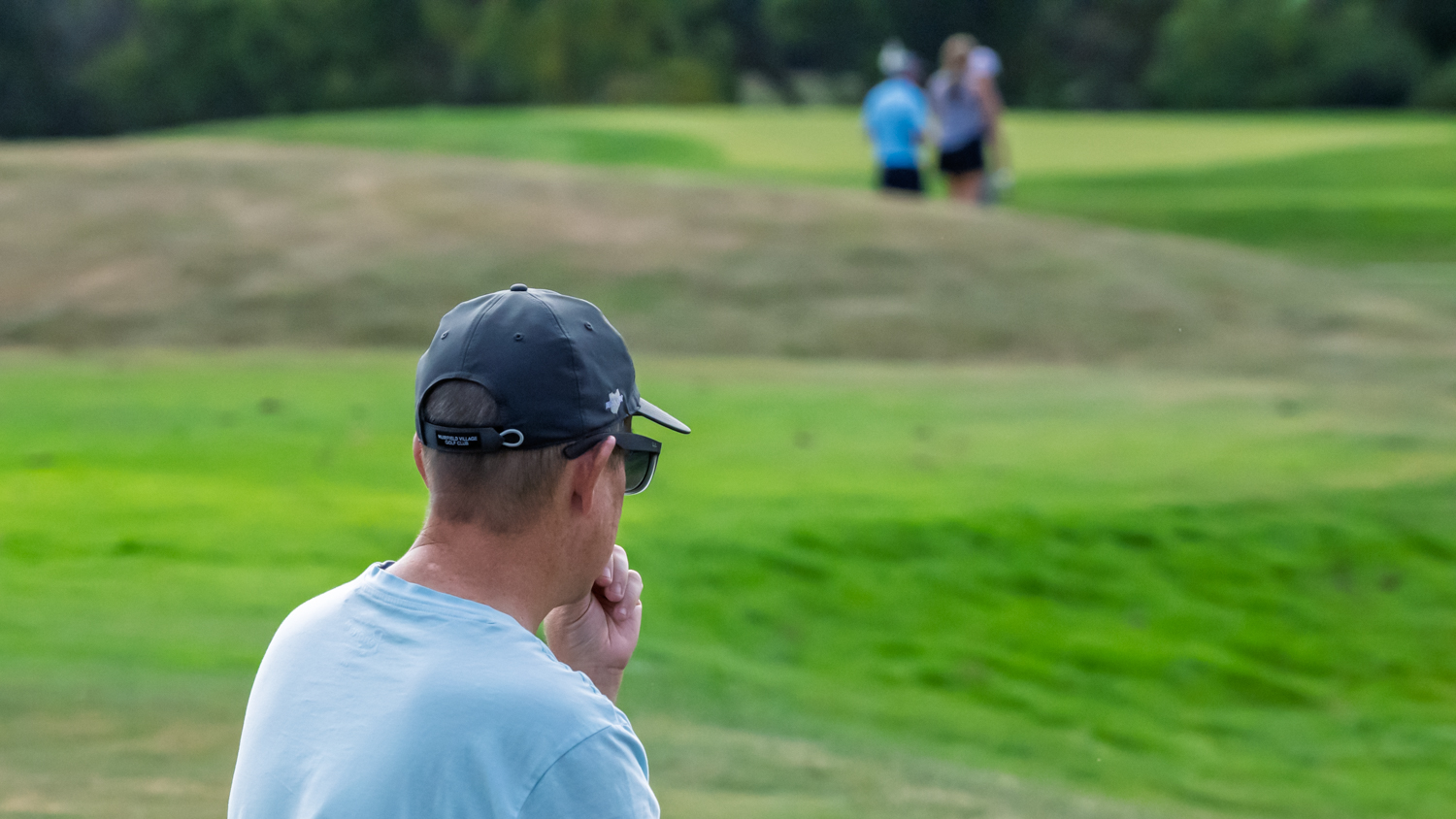 Olivia Huffman's dad watching her play golf